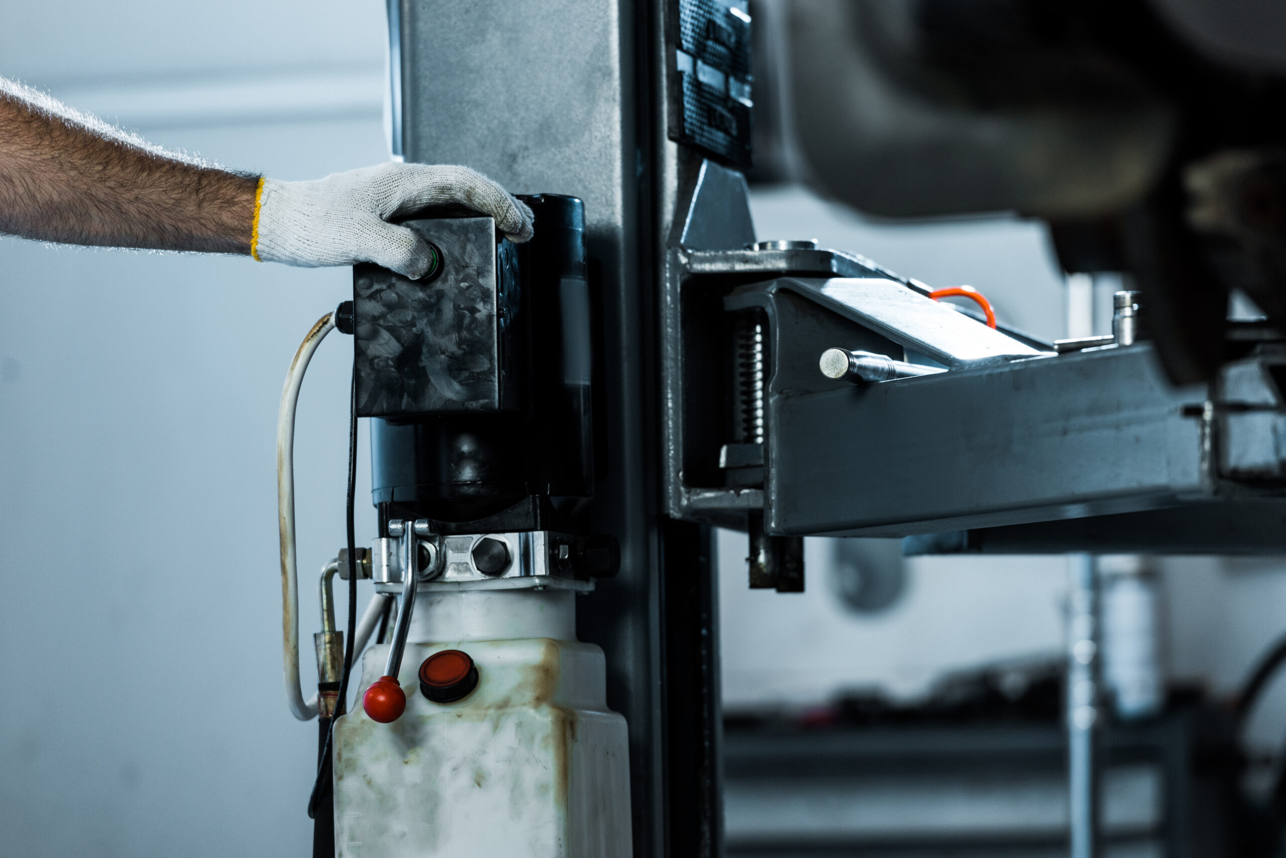 hand operating machinery in a garage workspace 2026 09 22 21 25 36 utc